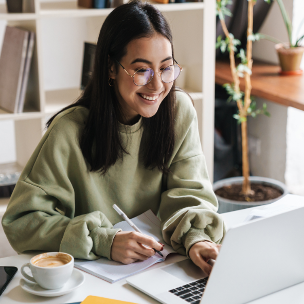 Engage your donors online; woman at a computer smiling