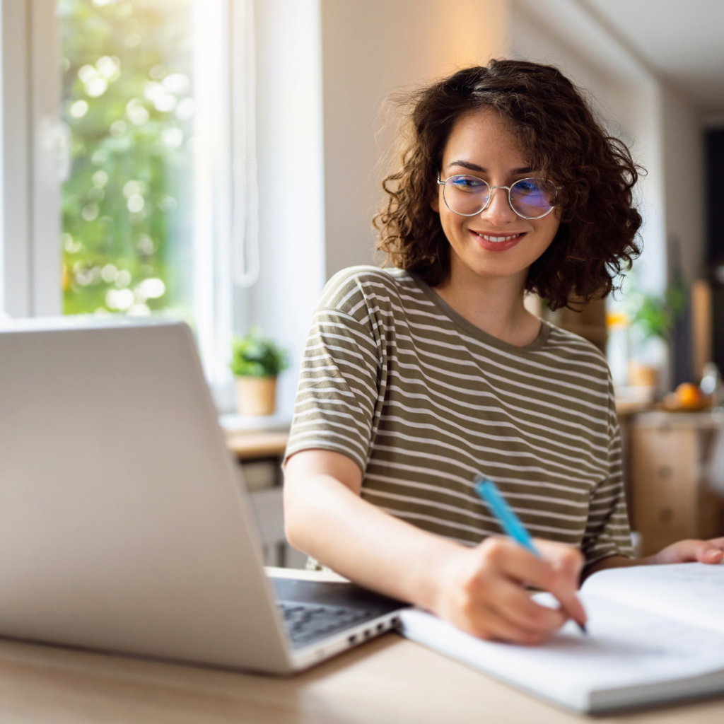 nonprofit graphic design services - Woman on computer smiling